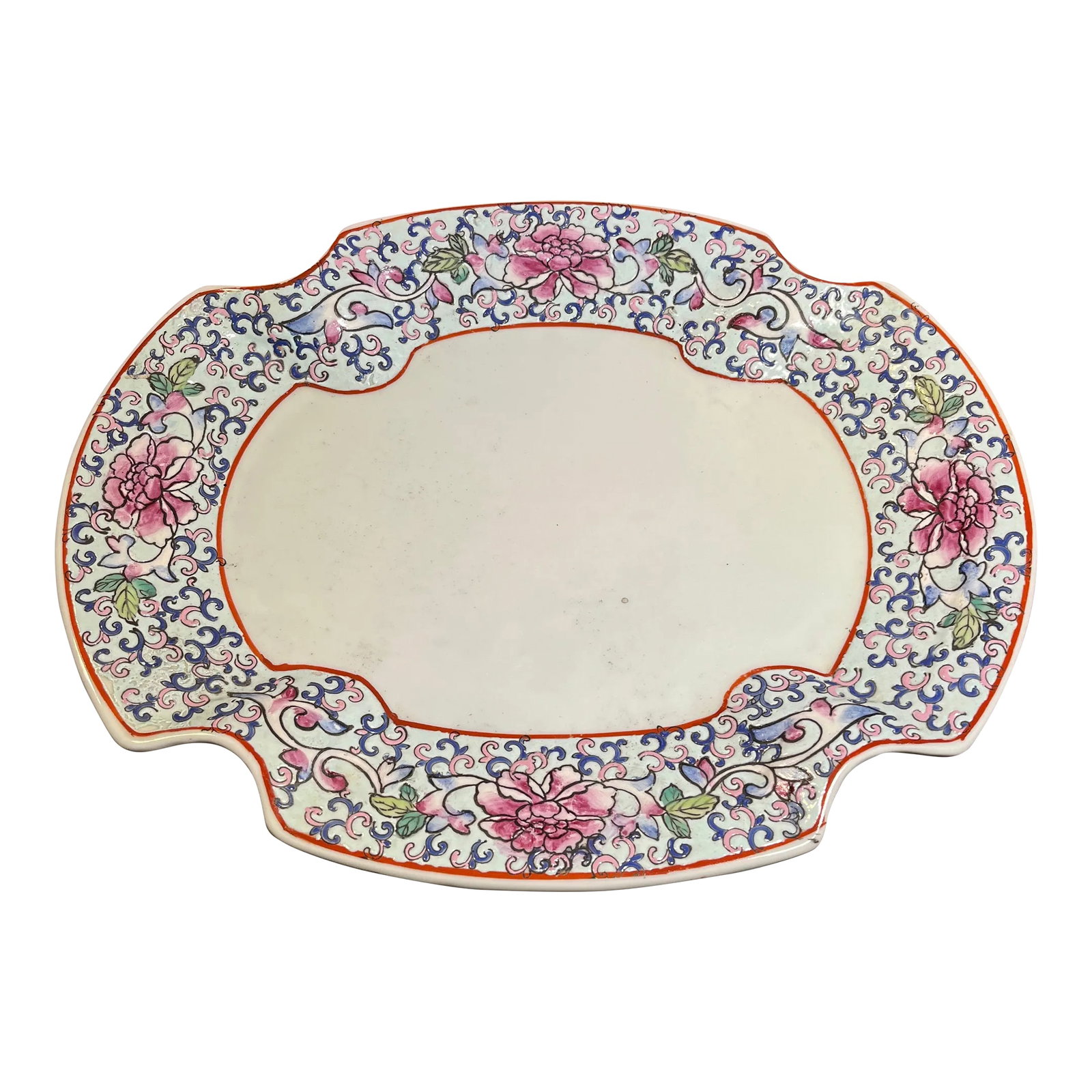 Early 20th Century Chinese Famille Rose Enameled Porcelain Dish: Scalloped curvature on this heavy and durable serving platter. Antique white with floral motif around rim having notes of pink, lavender, and green. Condition: Alterations: Original Condition