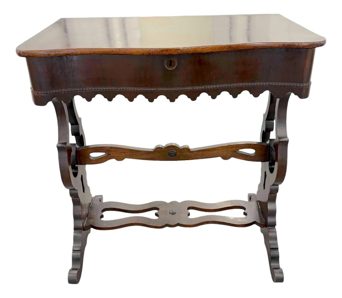 Walnut Victorian Parlor Side Table With Drawer: Walnut Victorian Parlor Side Table With Drawer This is a stunning example of mid 19th century craftsmanship. The table has two side legs, intricately carved, connected by a double trestle. There is a