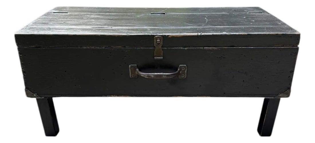 Rustic Black Painted Wood Tool Storage Bench Coffee Table: Offering a drenched-in-character low-profile bench with hinged lid for storage. Marks, nicks, scuffs with aged paint patina. In as-found naturally aged condition. At some point legs may have been adde