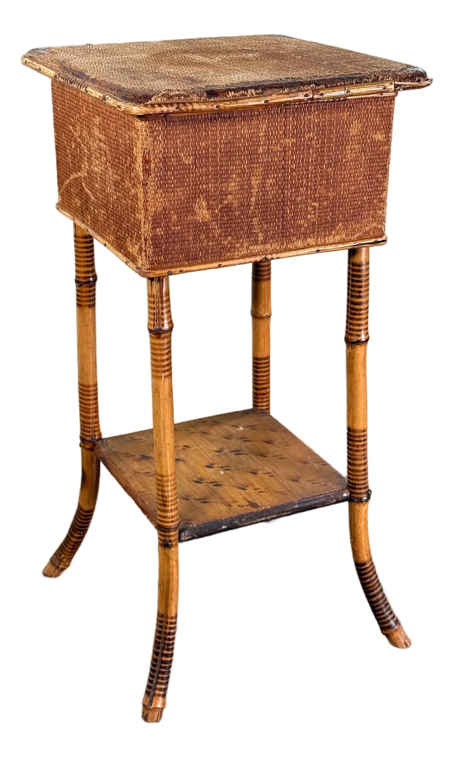 Antique Bamboo Sewing or Storage Stand With Lift Top Woven Case: This antique bamboo stand features a rectangular lift-top woven case mounted on four turned bamboo legs with a lower bamboo shelf, and it includes a divided interior tray for sewing or small item
