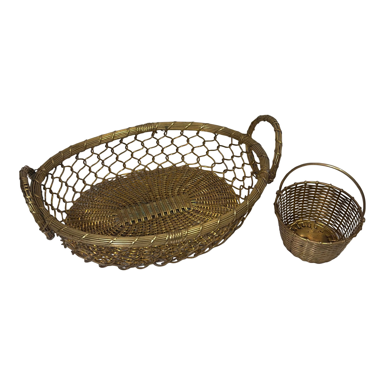 Vintage Castilian Imports Woven Brass Tabletop Baskets - Set of 2: An authentic mid-century set of two hand-woven brass wire tabletop baskets by Castilian Imports, featuring an exceptional textured metal weave and a warm, aged golden patina. Handcrafted in India,