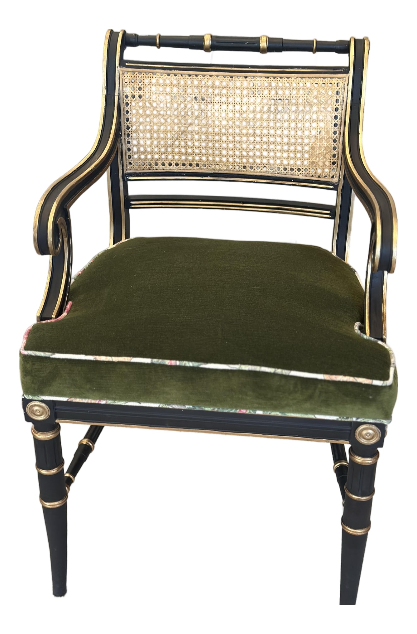 Antique Regency-Style Ebonized & Gilt Armchair With Cane Back & Green Velvet: A beautifully proportioned antique Regency-style armchair, distinguished by its elegant ebonized frame, classical gilt detailing and gracefully sculpted silhouette. The chair features sweeping open