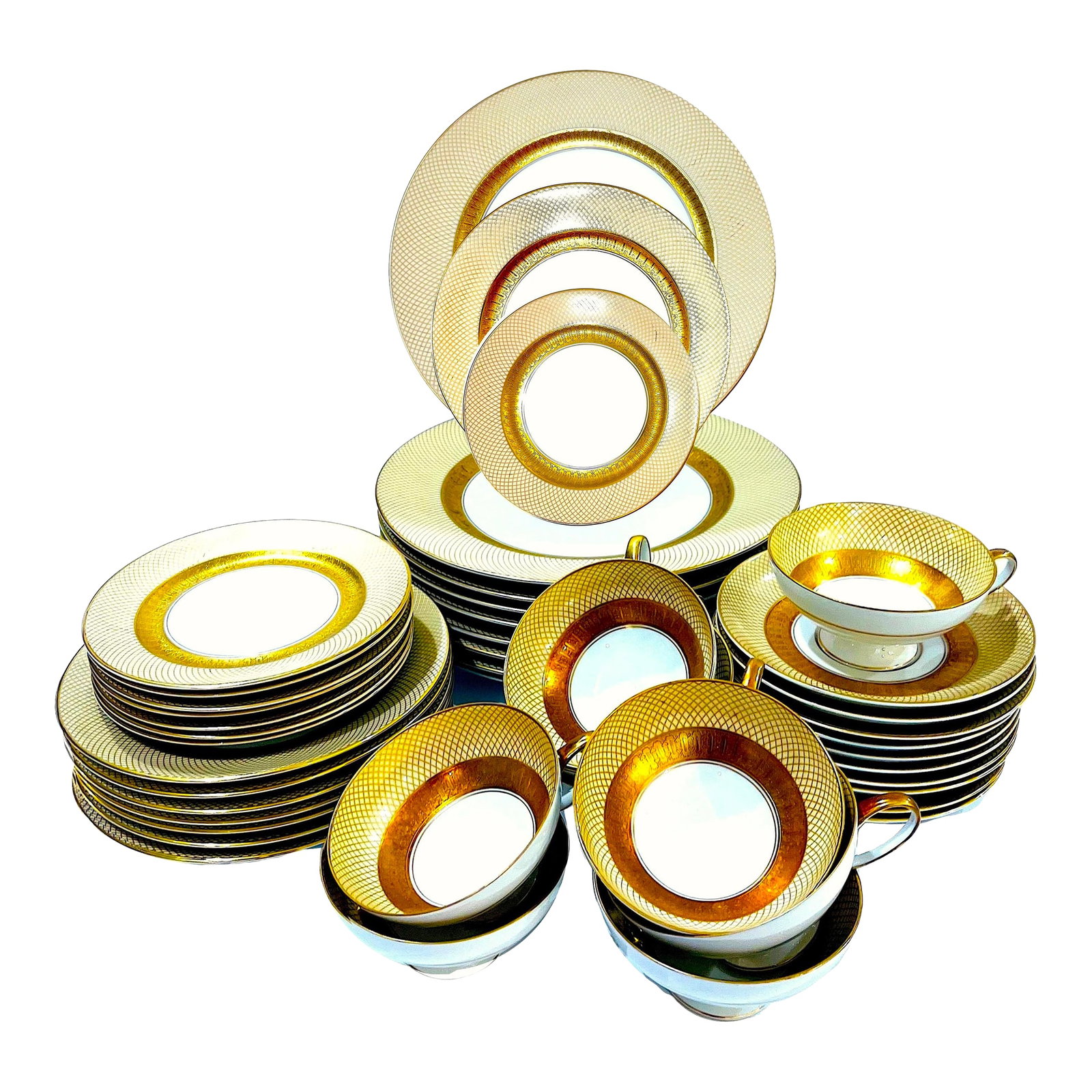 1960s Rosenthal Golden Grail Encrusted Gold Porcelain Dinnerware by Raymond Loewy - 45 Piece Service: Beautiful 1960's 24 carat gold encrusted and decorated fine porcelain dinnerware set in the "Golden Grail" pattern by Rosenthal. The design features a wide beige band decorated with gold outer rim