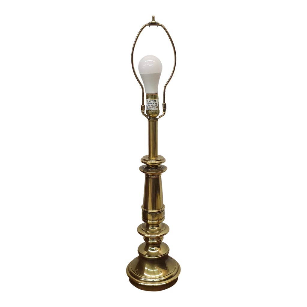 Stiffel Mid-Century Polished Solid Brass Colunm Table Lamp: Stiffel Mid-Century Polished Solid Brass Colunm Table Lamp Measures 6" in width, 6" in depth and 21" in height to the top of the light socket, 28" in height to the top Condition: Alterations: Original
