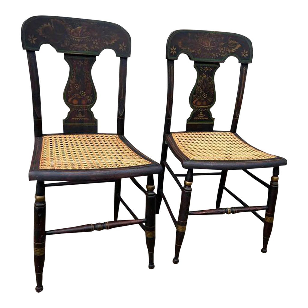 19th Century Pair Antique Ebonized Painted Gilt Bergere Cane Seat Side Chairs: 19th Century Pair Antique Ebonized Painted Gilt Bergere Cane Seat Side Chairs All stenciling designs are done overtop wood painted black. The front two legs and stretcher, in between, are turned and
