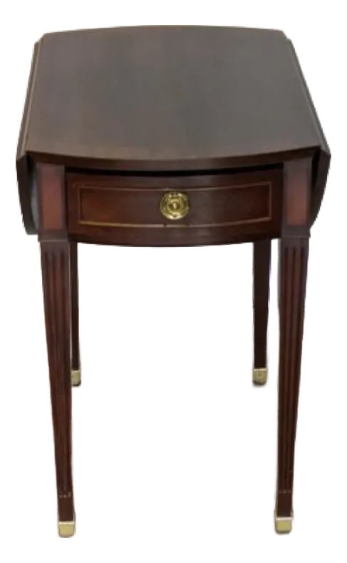 1960s Baker Furniture, Mahogany Drop Leaf Pembroke Accent Table: Baker Furniture, Mahogany Drop Leaf Pembroke Accent Table. Great Detail and Design with a Banded Edge Inlay on Table Top, Fluted Tapered Legs with Brass Capped Feet, Single Drawer with a Brass Pull.