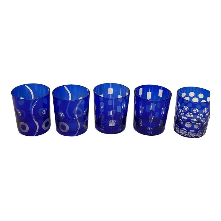 Bohemian Czech Crystal Cobalt Blue Tumblers by Ajka Hungary Set of 5: Bohemian Czech Crystal Cobalt Blue hand blown Cut to Clear Tumblers by Ajka Hungary circa 1980 Set of 5. Handcrafted by Ajka Hungary, a classic maker of quality crystal since 1878. A Beautiful Cobalt