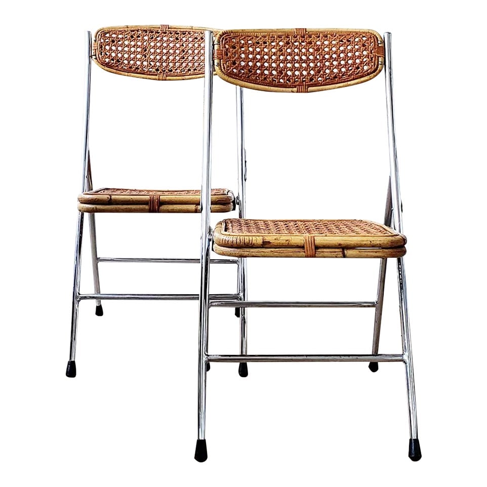 1960s Mid-Century Chrome and Cane Folding Chairs - Set of 2: This is a set of very rare chrome and cane / rattan / wicker folding chairs. Guessing from the 1950s to 1970s? Haven't been able to find anything quite the same. Probably Italian, but could be