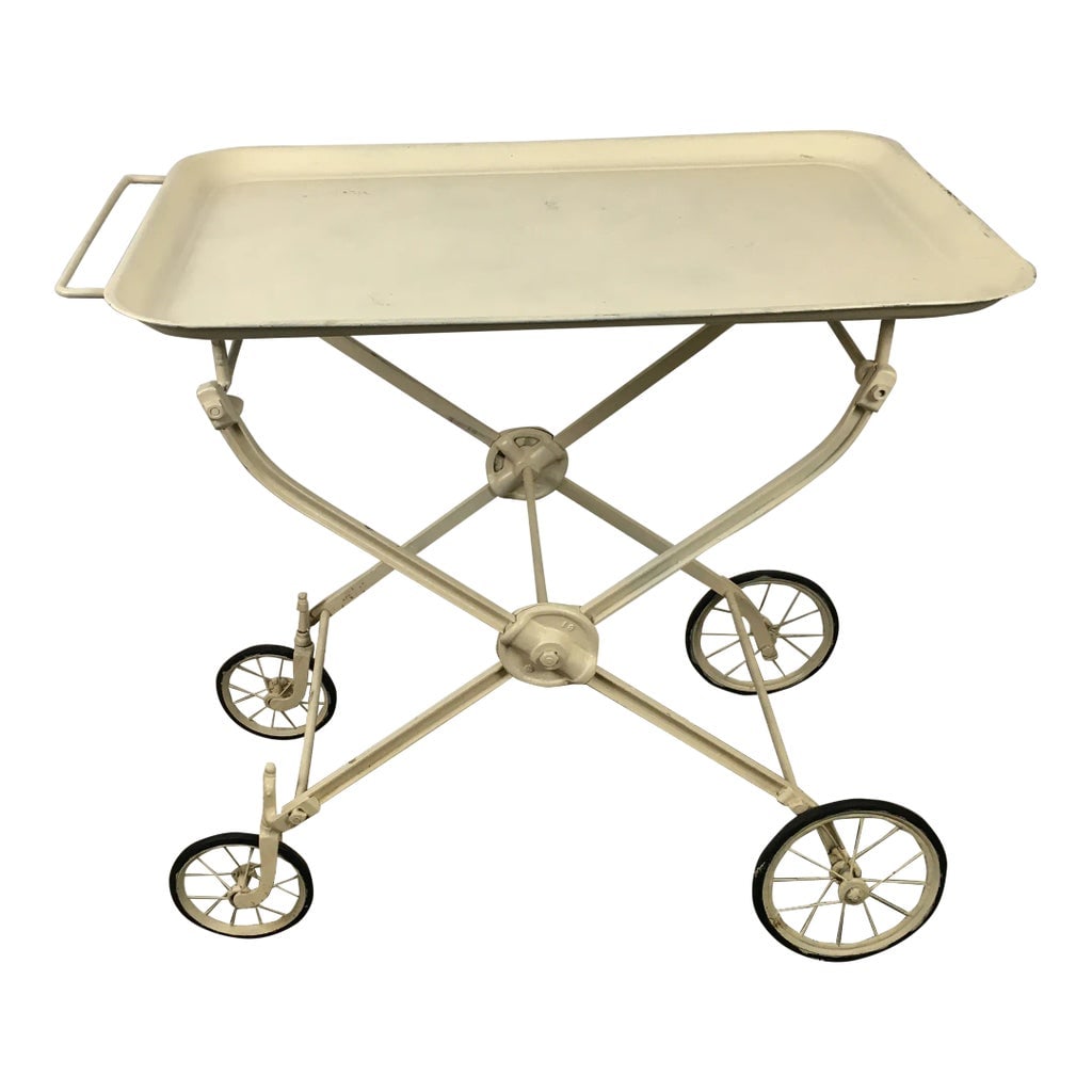 Antique Industrial Folding Bar Tea Cart Hospital Hotel: An early 20th century industrial metal folding cart manufactured for a hospital or hospitality setting. This has a repainted finish in an off white color. This is a great addition for style and