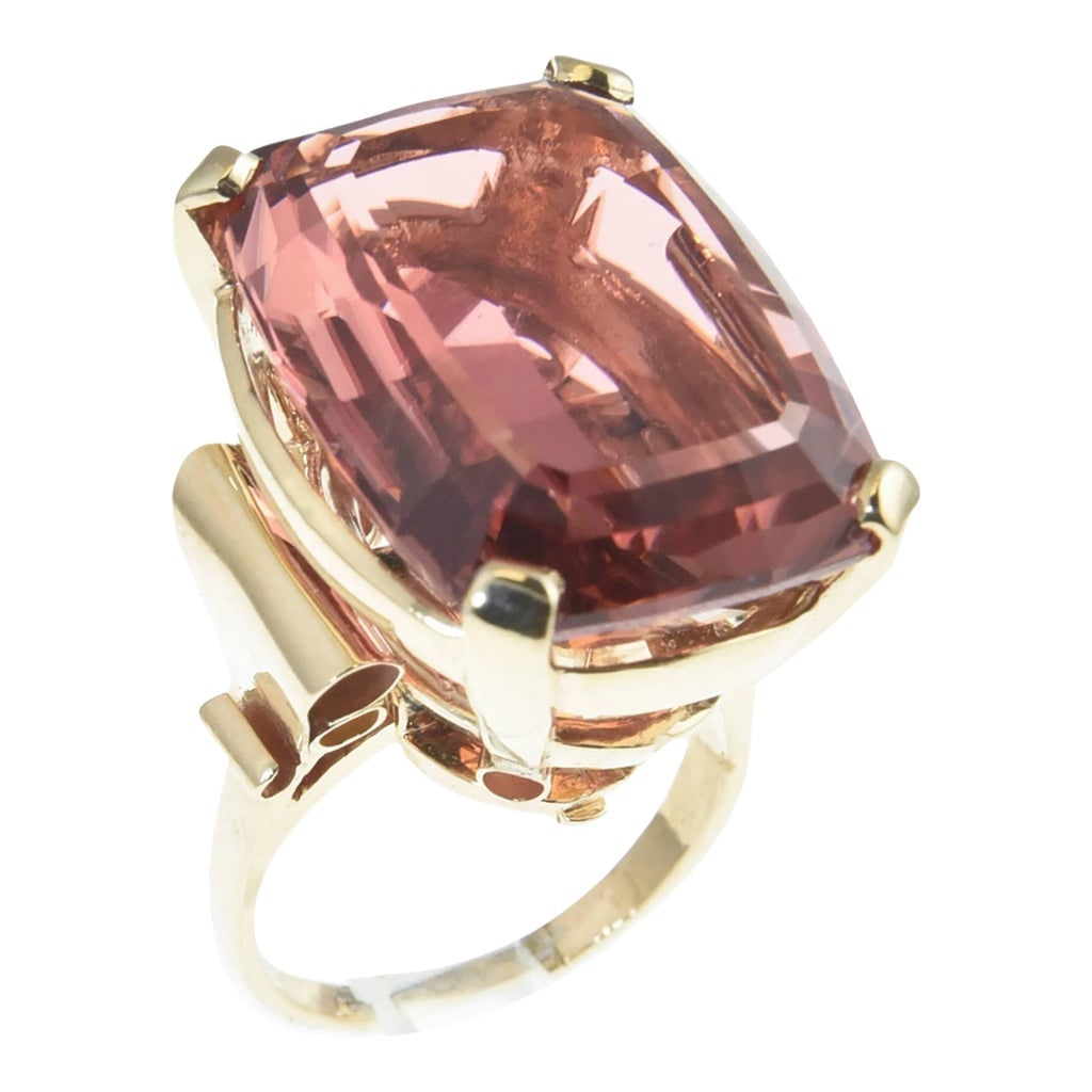 Large Rare Color Peach Pink Tourmaline Gold Cocktail Ring size 7.25: The Tourmaline is exquisite. The stone weights just over 32c. It is a clean stone with a lovely rare color. The 14k yellow gold mounting as scroll shoulders. US size 7.25. It can be sized. Condition: