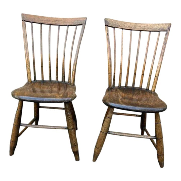 Early 20th Century Pair of Antique American Primitive Style Windsor Side Chairs By O. Bailey J.: Pair of Antique American Primitive Style Windsor Side Chairs Marked by O. Bail.ey.. J Features a plank seat, spindle back and turned legs Very sturdy and comfortable Approximate measures: Height 33"