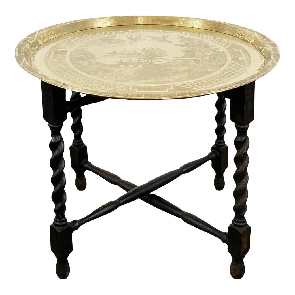 Vintage Engraved Blue Willow Pattern Brass Tray Table: Vintage Chinoiserie style Blue Willow pattern engraved on a 22"dia round brass tray. Tray sits atop collapsible wood base with barley twist turned legs. A stunning vintage statement piece! Natural pat
