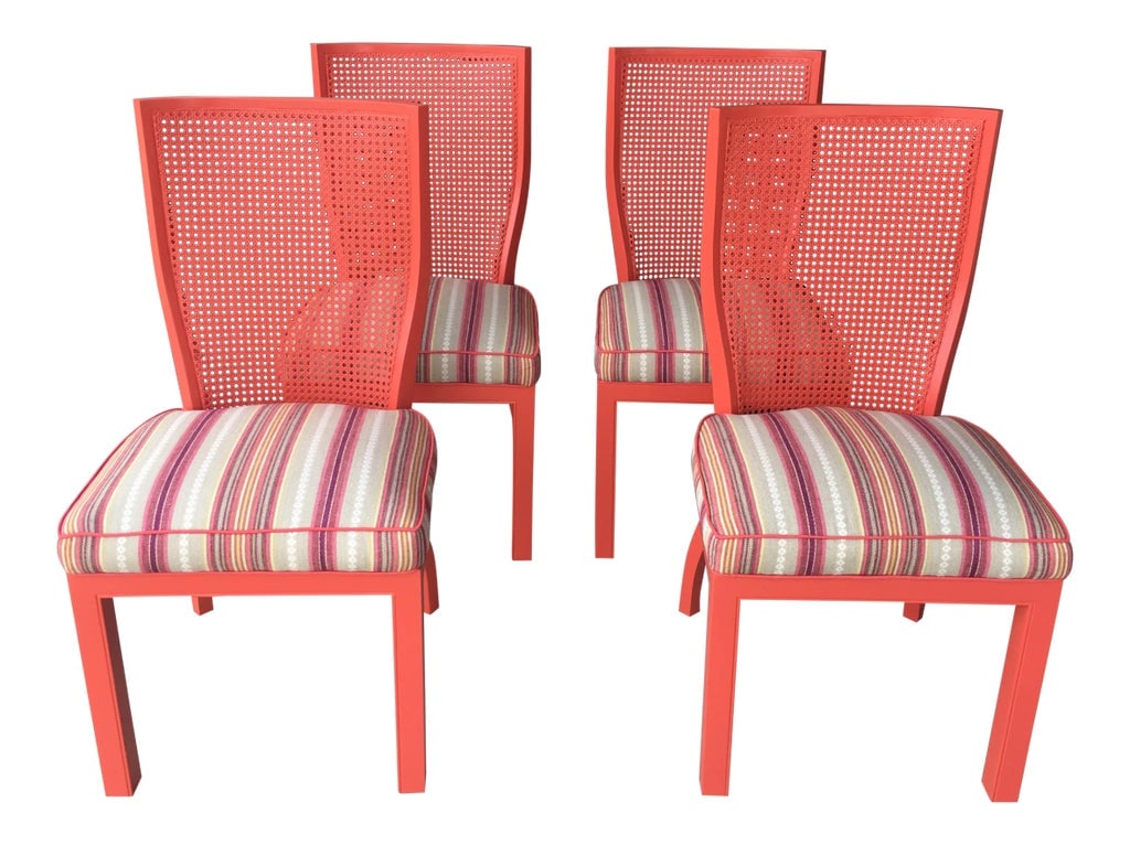 1970s Vintage Cane Back Coral Chairs- Set of 4: Vintage 1970's cane back chairs with a unique curved back. These were newly lacquered in a beautiful coral color with new upholstery in a boho linen stripe. These are in excellent condition. Please
