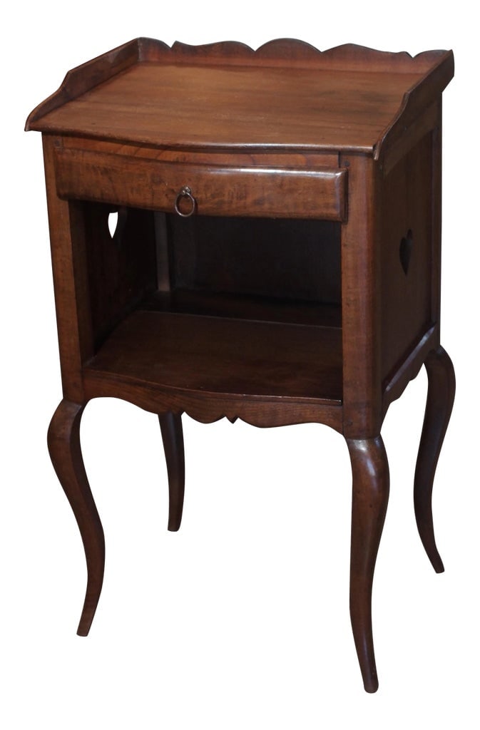 19th Century French Walnut Side Table: End 19th century petite walnut side table. Top with gallery over a bowed drawer and shelf. Heart cut out of each side. The whole lifted on delicate cabriole legs. Condition: Alterations: Original Cond