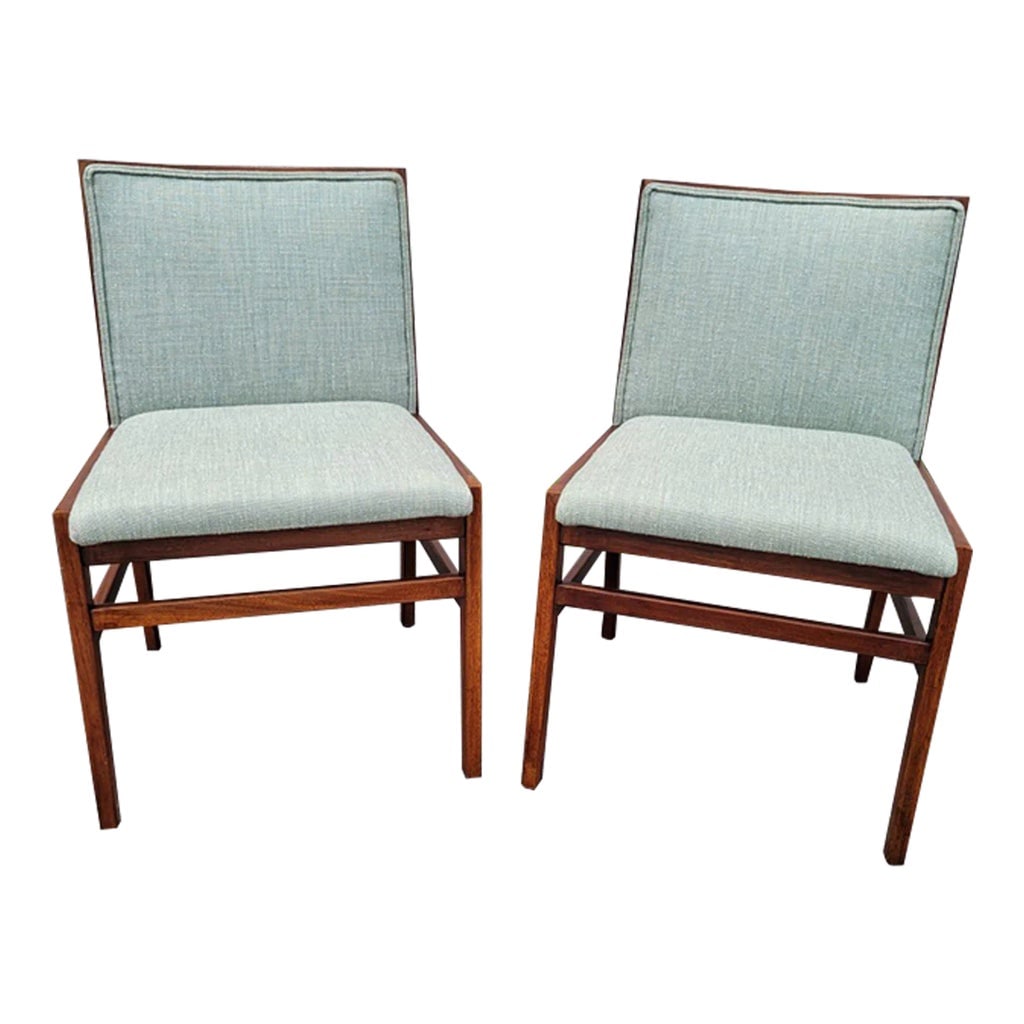 Pair of Mid 20th Century Teakwood Side Chairs with New Upholstery: Great pair of modern side chairs, each one featuring a sturdy teakwood frame, with a padded back and inset seat, newly upholstered in a light gray fabric. They complement any decor. Dimensions: