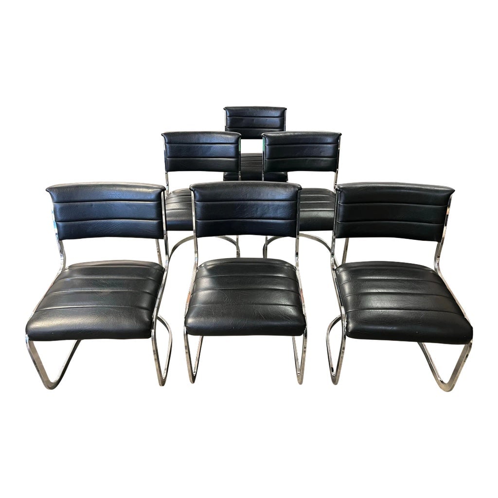 1970's Chrome Sling Dining Chairs in Black Vinyl- Set of 6: 1970's chrome and black vinyl sling chairs. The vinyl is in excellent condition along with the chrome frames. Set of 6 dining chairs, Sold as a set. They could be a bit later than 70's. Condition: Alt