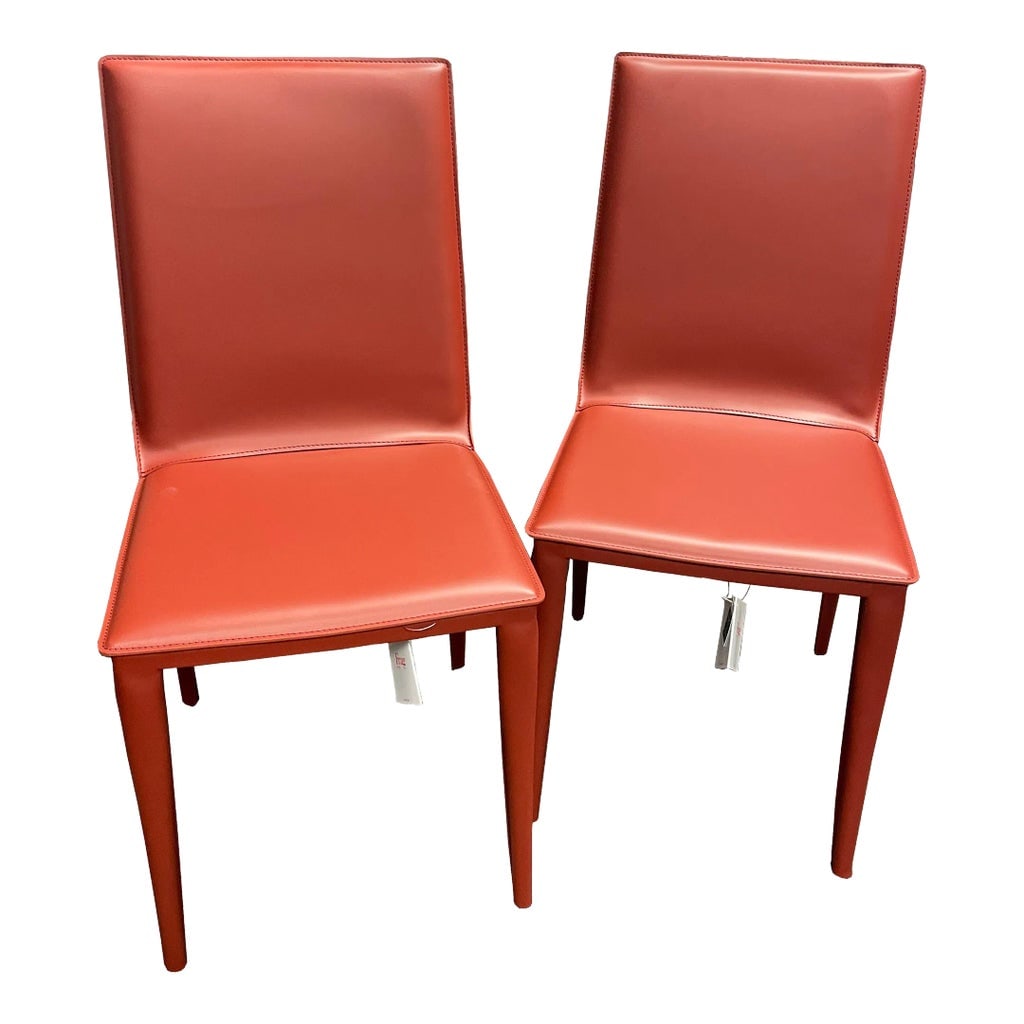 Design Within Reach Russian Red Bottega Chairs- Set of 2: The Bottega Chairs from Design Within Reach was designed from harmonic sheet steel and tightly wrapped with split-grain leather, dyed in Russian Red, to provide comfort and support. The seat is made