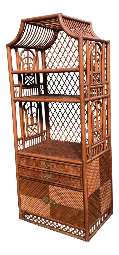 Vintage Rattan Chinoiserie Pagoda Etagere: Fantastic piece with weaved rattan shelves. Penci reed detail with Brighton pavilion style rattan details Two draws and a cupboard. Sturdy beauty Condition: Alterations: Original Condition Unaltered