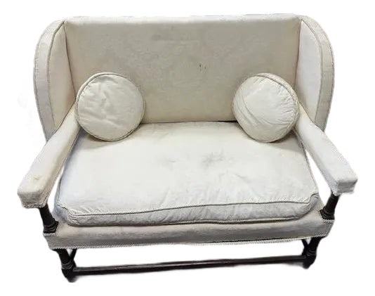 Late 19th Century English Oak Settee: This is a really unique settee. It has some features of William and Mary settees but also Cromwellian features as well. It does need to be reupholstered. Otherwise it is well made and sturdy. It is ma