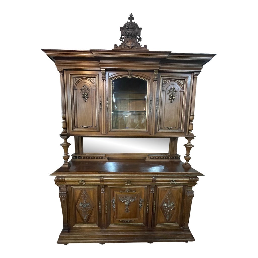 Antique French Renaissance Revival Walnut Sideboard Credenza W/ Hutch: Features richly carved floral details, turned columns, paneled doors, and an ornate crown crest. The upper hutch w/ mirrored panels and shelving over a spacious lower credenza w/ drawers and