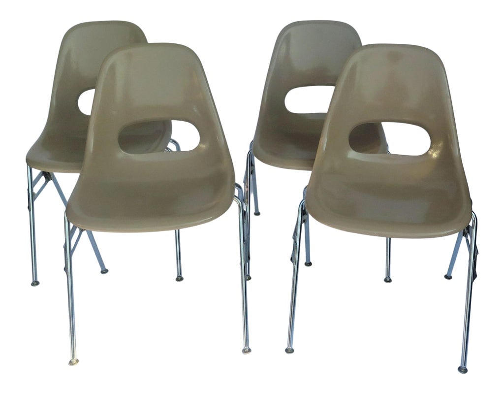 1980s Herman Miller-Style Fiberglass Shell Chairs- Set of 4: These chairs are a deep creamy beige. Produced in the material Ray and Charles Eames originally chose for their original models of eco fiberglass chairs, present the same comfortable surface and