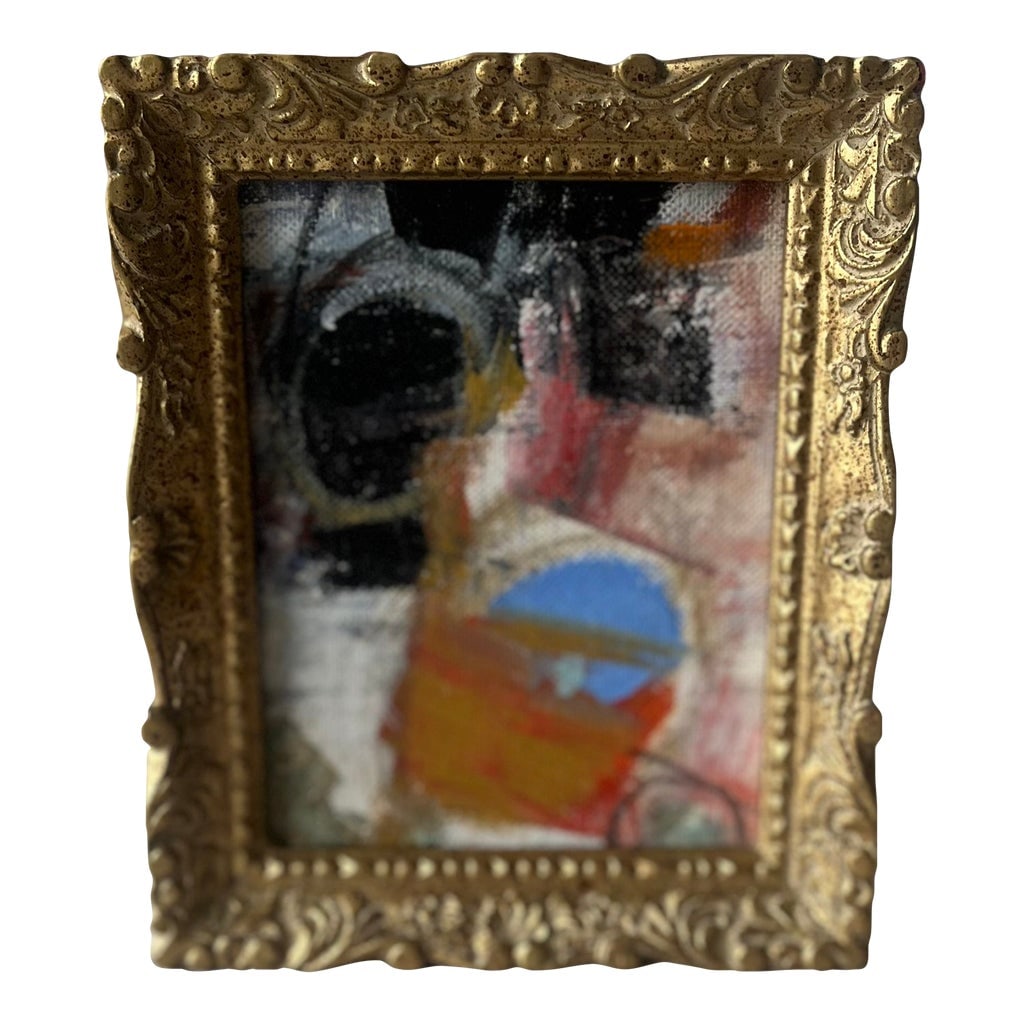 Small Abstract in Gold Frame: This striking miniature abstract painting is a bold pop of color and texture, perfectly housed in an ornate vintage-style gilt frame. With its dynamic brushwork and layered palette of vivid oranges,