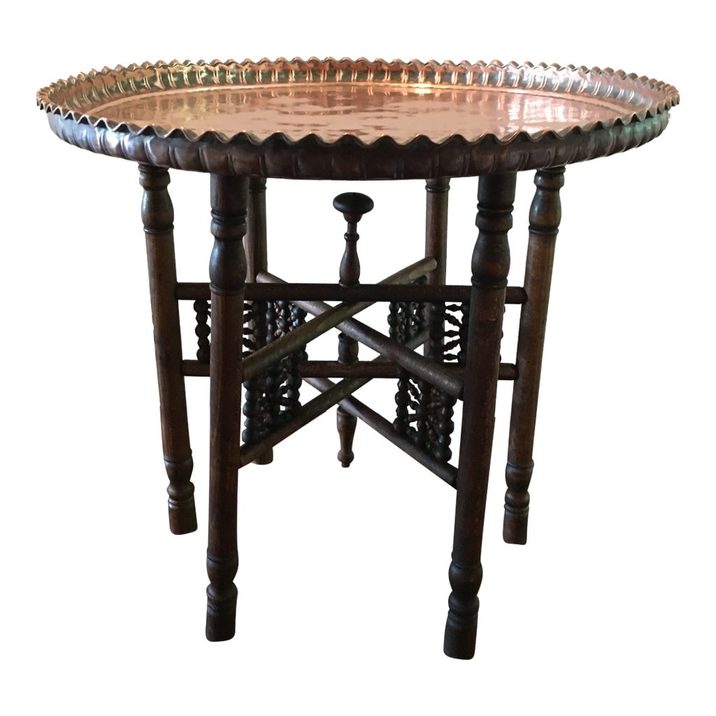 Antique Turkish Copper Tray Table on Folding Wooden Stand: Antique Turkish Copper Tray Table on Folding Wooden Stand. The heavy, hand hammered cooper tray has a thick, scalloped pie-crust edge. The back of the tray has a hook for hanging on a wall, if desired