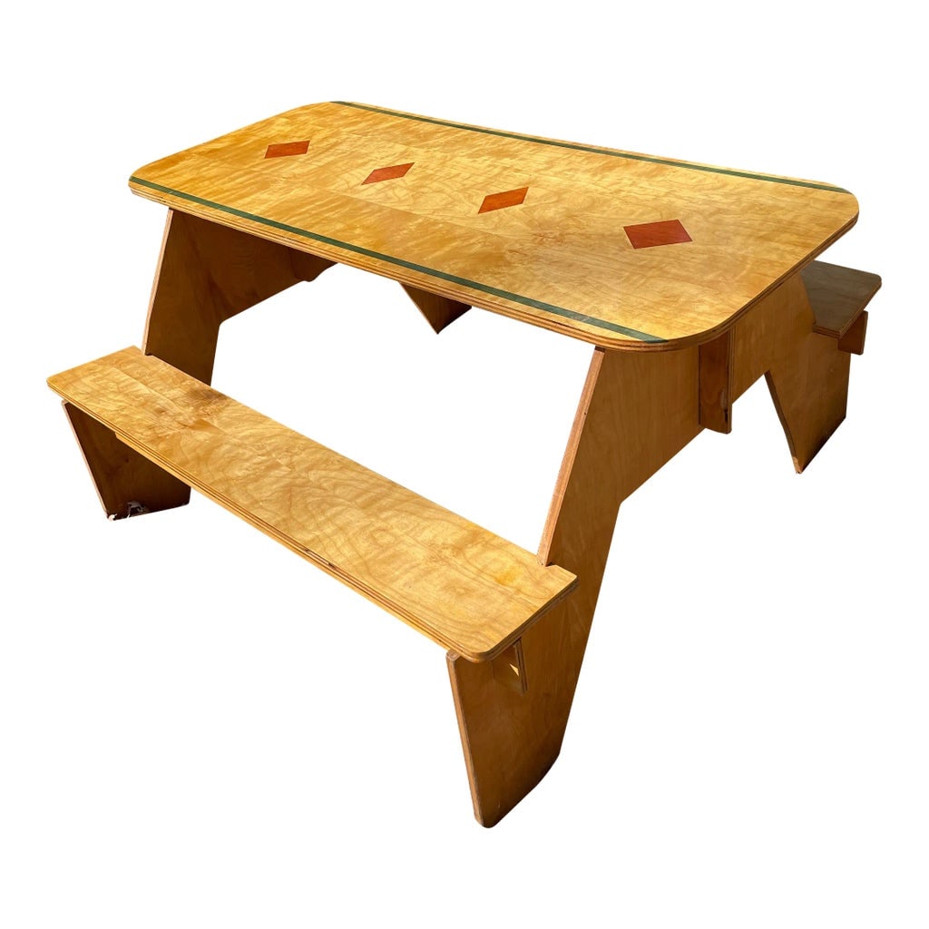 1960s Custom-Made Puzzle Piece Picnic Table With Wood Inlay: One of a kind picnic table uniquely designed in a puzzle piece manner. Pieces slot into one another to create a sturdy table that is lightweight and disassembles to take up less space. Wood inlay