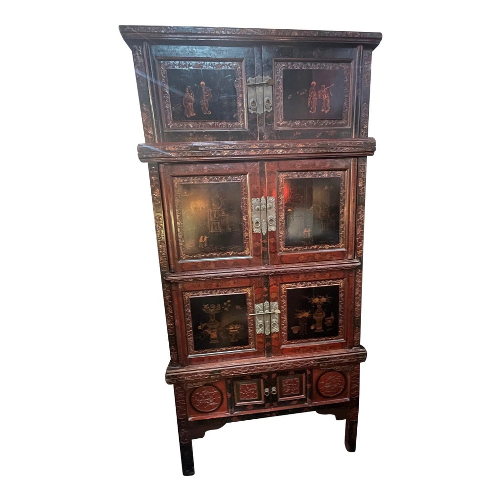 Antique 19th Century Chinese Wood Black Lacquer 3 Tiered Cabinet: Antique Chinese hand made wood cabinet from the 19th century. It has a lot of carving and wonderful butterfly lock plates. There even appears to be a scene of westerners and a western style building