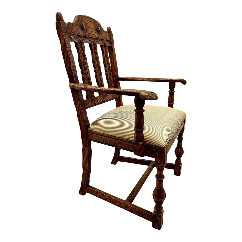 19th Century Oak Chair British Parlor Wood Arm Tudor Style Antique Vintage: Welcome your guests with this side, parlor or dining room chair that brings a true baroque feel to any surrounding. This 19th century British chair exudes old-world charm with details such as strong