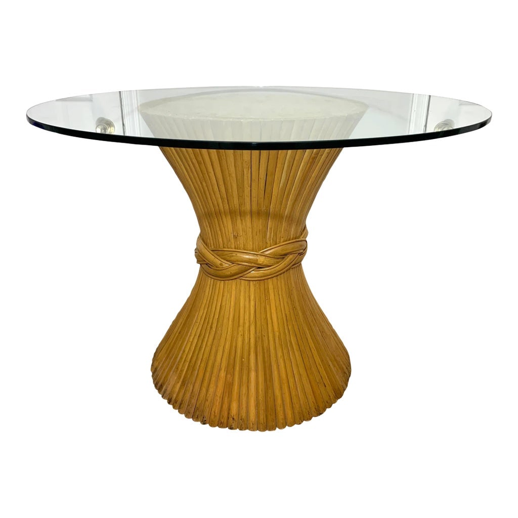 Mid 20th Century McGuire Style Sheaf of Wheat Bamboo and Glass Dining Table: Vintage 1970s Mcguire style sheaf of wheat rattan dining table base with thick glass top. Interesting tied rattan design and braided ring. Glass top 42" diameter, 1/2" thick Overall height 29 5/8"