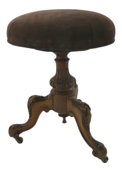 Carved Walnut Piano Stool Upholstered Seat: Carved walnut piano stool. Brown suede seat. Top is stationary, is not adjustable. 19 x 22 x 16 c 1870 Condition: Alterations: Unknown Imperfections: Some Imperfections Condition Notes: Vintage item, 
