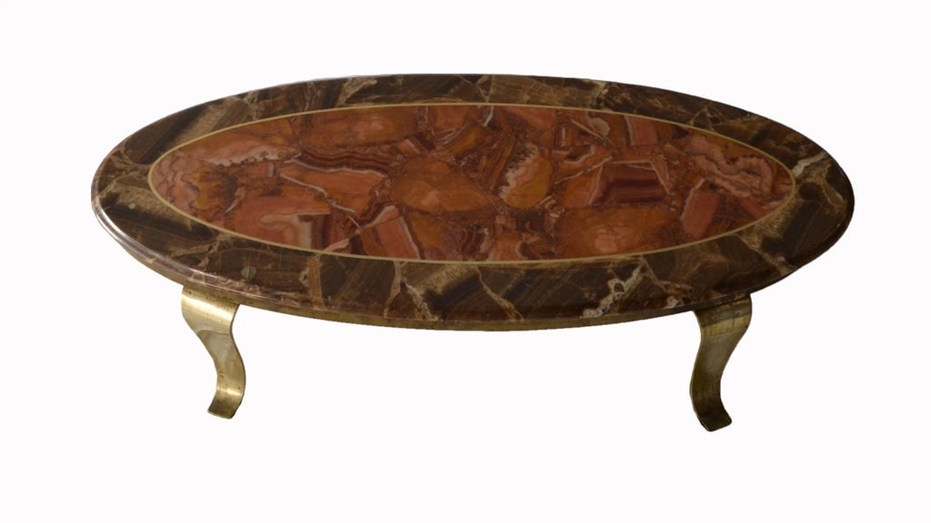 1970s Vintage Mueller Faux Marble Oval Table: Vintage 1970's faux marble oval table signed by Mueller. The faux marble looks real in these beautiful pinks, salmon, and browns with scalloped solid brass legs. It was made in Mexico. A real
