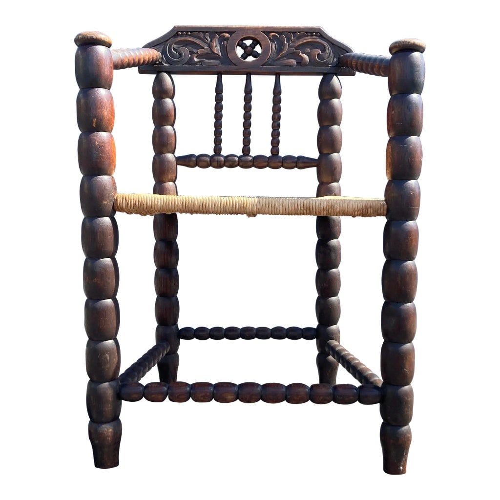 Antique Oak and Rush Arm Chair: Beautiful antique carved oak armchair with a rush seat. In good condition with some normal wear. Believed to be from Europe. Condition: Alterations: Original Condition Unaltered Imperfections: Some