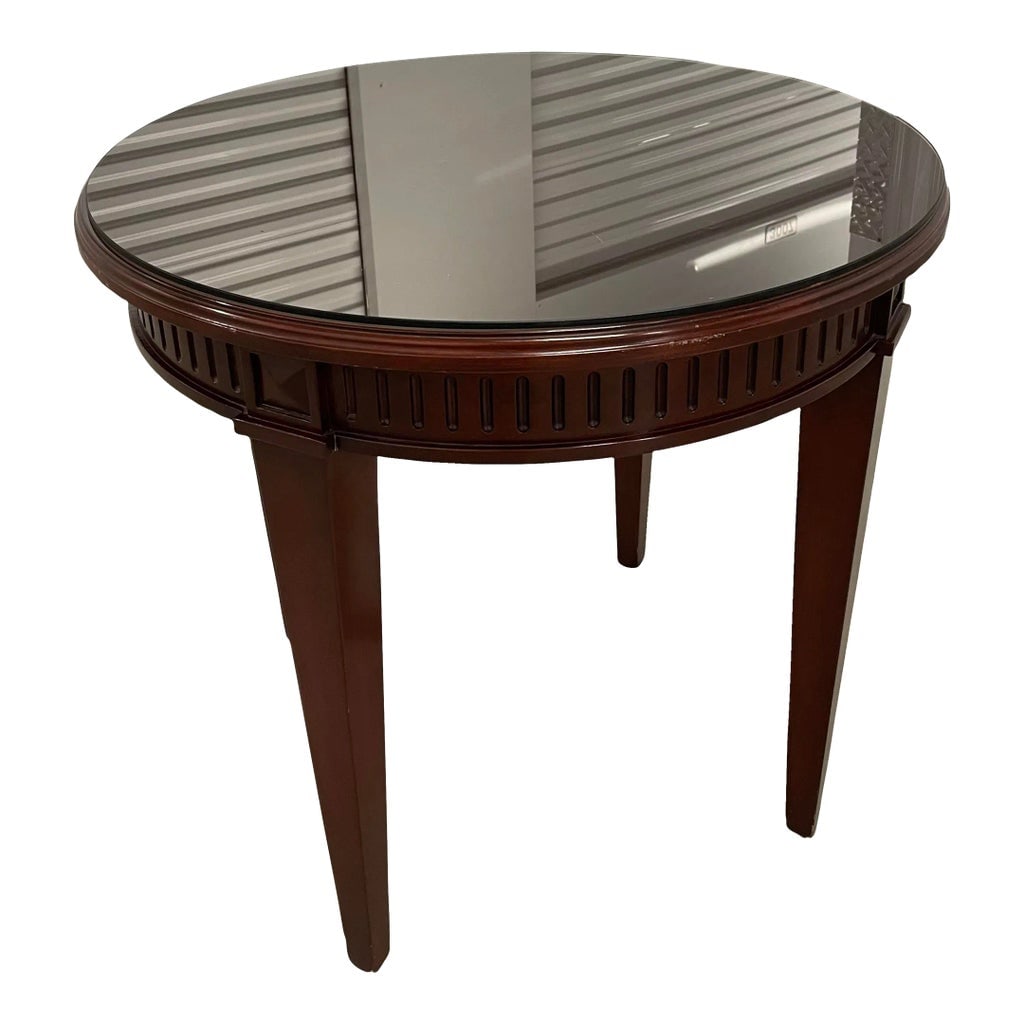 1990s Contemporary Nancy Corzine Mahogany Side Table: Offered here is a mahogany accent table by Nancy Corzine. This side table has a java finish and comes with a custom smoked glass table top protector. Condition: Alterations: Original Condition