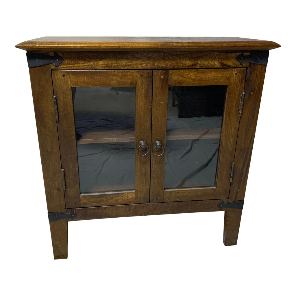 Rustic Hall or Buffet Cabinet With Iron Ring Pulls: Solid wood cabinet with glass doors and finished with a dark walnut stain. Corners are adorned with iron plates and door pulls with iron rings. Condition: Alterations: Original Condition Unaltered Imp