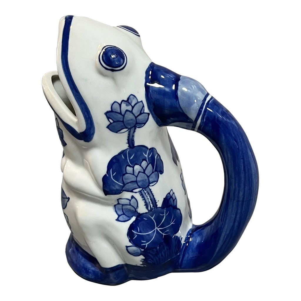 Blue & White Chinoiserie Frog Pitcher: Blue and white frog pitcher with lovely floral design. This would look great in a chinoiserie styled space or just about anywhere you need a little dash of quirky! Condition: Alterations: Original