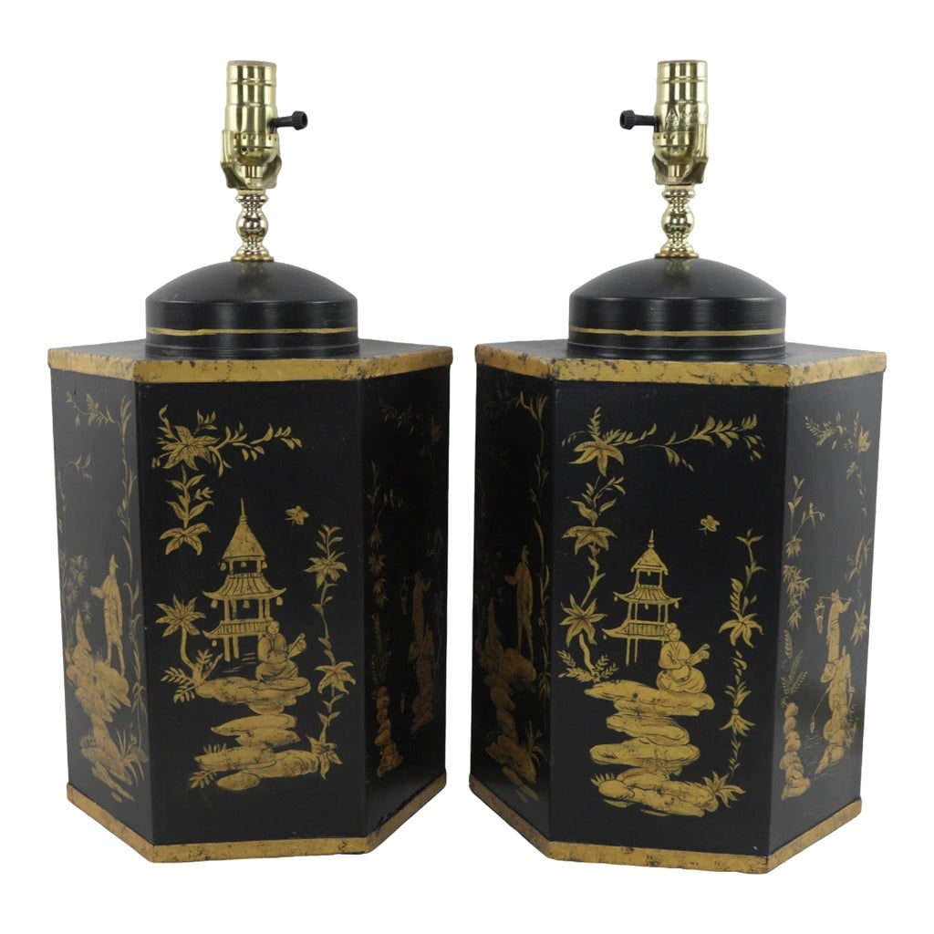 Pair of Black Vintage Export British Tea Cans Hand Painted Chinoiserie Hexagonal Table Lamps: Pair of black vintage export British tea cans with painted Chinoiserie hexagonal table lamps. This pair of table lamps is a Chinoiserie art form. Each piece is hand-painted by the artist, and each of