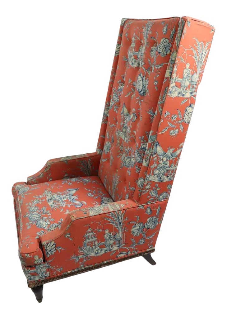 Exaggerated High Back Wing Chair: Dramatic high back wing chair of exaggerated elongated form. Great style, this chair will look spectacular once you do the restoration.The chair is structurally sound and sturdy, the fabric is worn,