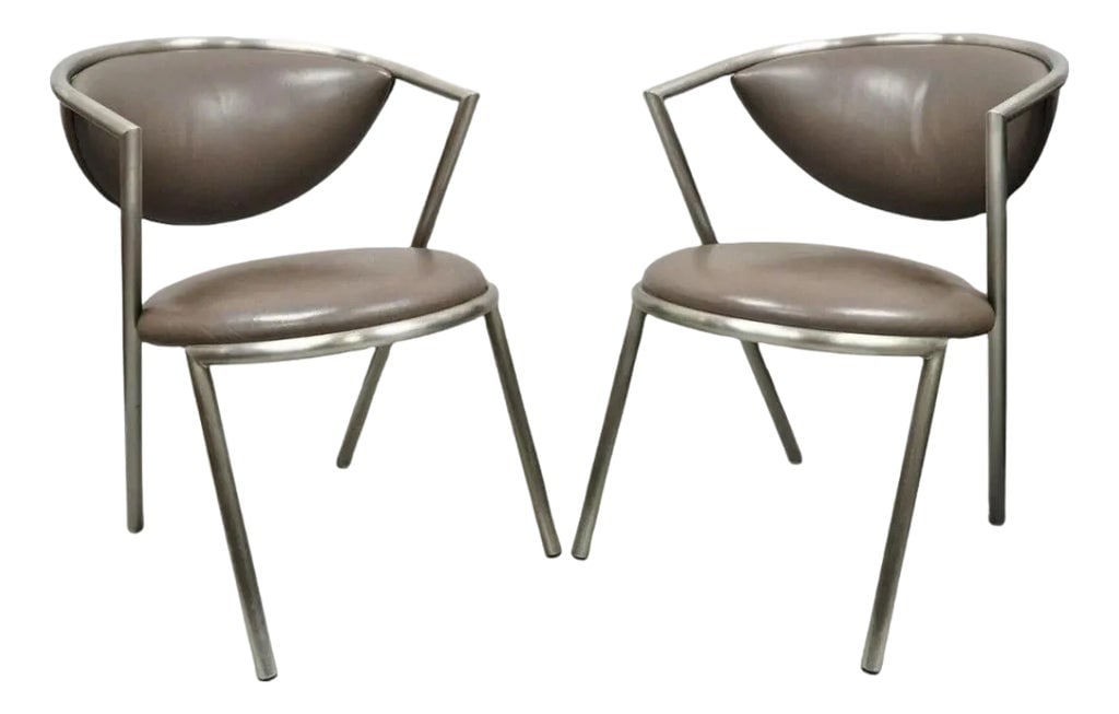 Vintage Brueton Mid Century Modern Tubular Steel Cat Eye Lounge Chairs - A Pair: Vintage Brueton Mid Century Modern Tubular Steel Cat Eye Lounge Chairs - a Pair. Item features brushed stainless steel frames, original brown vinyl upholstery, "cat eye" design to backs, round seats,