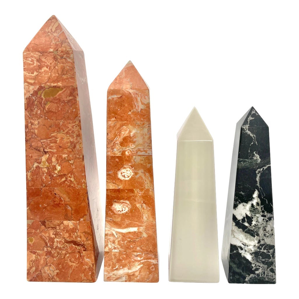 1980s Decorative Marble, Porcelain Obelisks- Set of 4: Striking set of four obelisks. Pair of (Italian) hollow orange veined marble, one (Italian) black solid marble, one white porcelain by Fitz & Floyd, Japan. Circa 1980. Large orange H 12 inches, Base