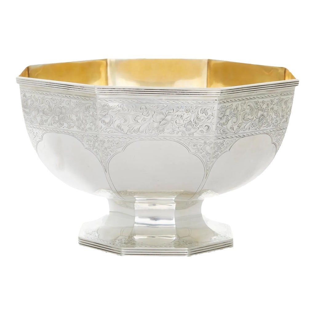 Sterling Silver / Gilt Barware / Centerpiece Bowl: Late 19th century sterling silver footed centerpiece bowl with exterior floral band design details and gold wash interior. The centerpiece bowl is in great antique condition. Minor wear consistent wit