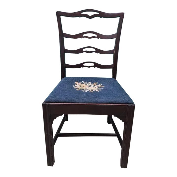Vintage Wooden Ladder Back Chair With Blue Cloth Seat and Floral Design: This chair is the perfect accent piece for your dining room, living room, entryway, or anything in between. It is made of solid wood and features a dark stain. It is sturdy and built to last, with qua