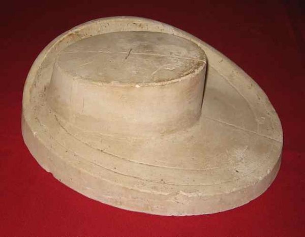 049: Plaster Hat Mold Prince Edward Island : Date: Unknown. Size: 11 ½” wide, 13” long, 4” tall (29.2 x 33.0 x 10.1 cm). Description: An item selected from the Log Cabin Museum in Murray Harbour, PEI.
