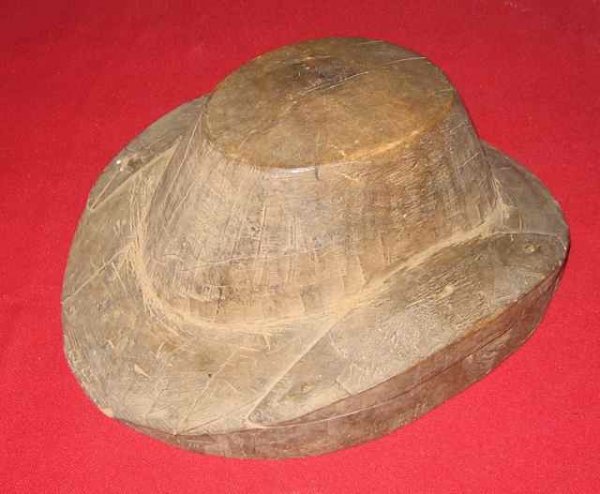054: Wooden Hat Mold #6 Prince Edward Island : Date: Unknown. Size: 9” wide, 12” long, 5 ½” tall (22..8 x 30.4 x 13.9 cm). Description: An item selected from the Log Cabin Museum in Murray Harbour, PEI.