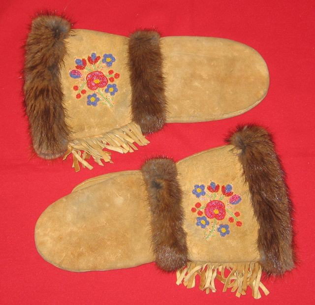 Vintage Métis Beaded Chopper Mittens: Title: Métis Beaded Chopper Mittens. Maker: Unknown. Size: 16” x 9” (40.6 x 22.8 cm). Date: c1940. Description: Deerskin with hand-stitched floral beadwork, and rabbit fur trim. Plaid cotton lini