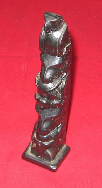 Miniature Argillite Totem Pole British Columbia '37: Title: Miniature Argillite Totem Pole. Maker: B. Clifford. Date: 1937. Size: 8 ½” tall, 2” wide, 1 ¾” deep (21.5, 5.0, 4.4 cm). Description: From the private collection of Pat & Connie Kent, f