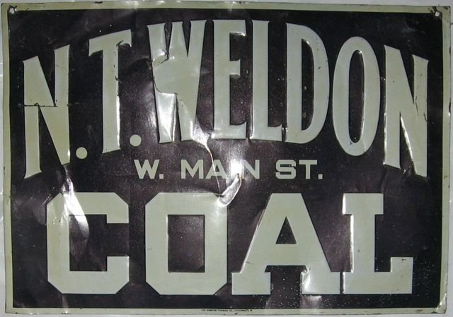 “N. T. Weldon Coal” Die cut painted tin sign: Made by Kemper-Thomas Co., Cincinnati, Ohio. Measures 14” x 20” (35.6 x 50.8 cm). Painted die cut sign on metal. Collection of Pat & Connie Kent, former operators of Granary Antiques, Fairfield, P