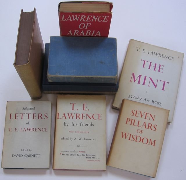“T. E. Lawrence” Books + Others, Lot of 9: . Description: Lot includes...a) “Revolt in the Desert” by T. E. Lawrence. Published by Jonathan Cape, London: 1927. 1st edition/5th printing. 446pp. Small 4to. Illustrated. Tan cloth with gilt ti