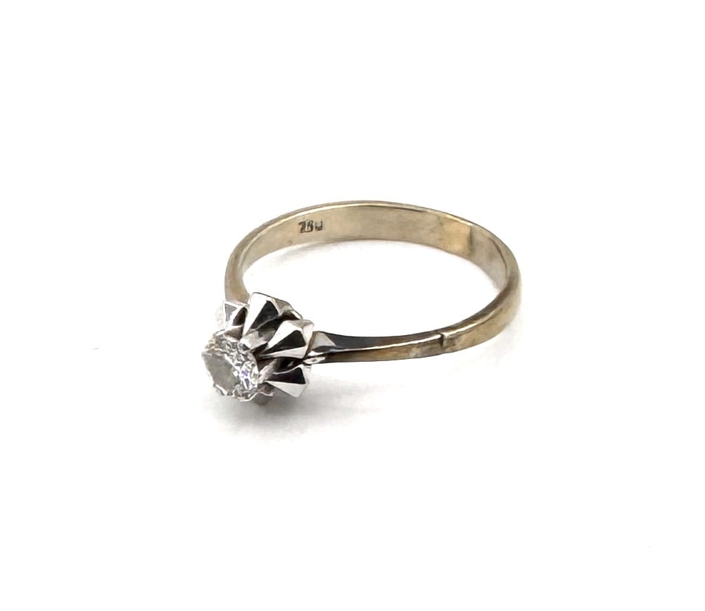 A DIAMOND SOLITAIRE RING A classic brilliant-cut engagement ring in 18k white gold: A timeless solitaire ring featuring a high-quality round brilliant-cut diamond weighing approximately 0.25 carat. The diamond is elegantly elevated in a classic four-prong "Tiffany-style" s